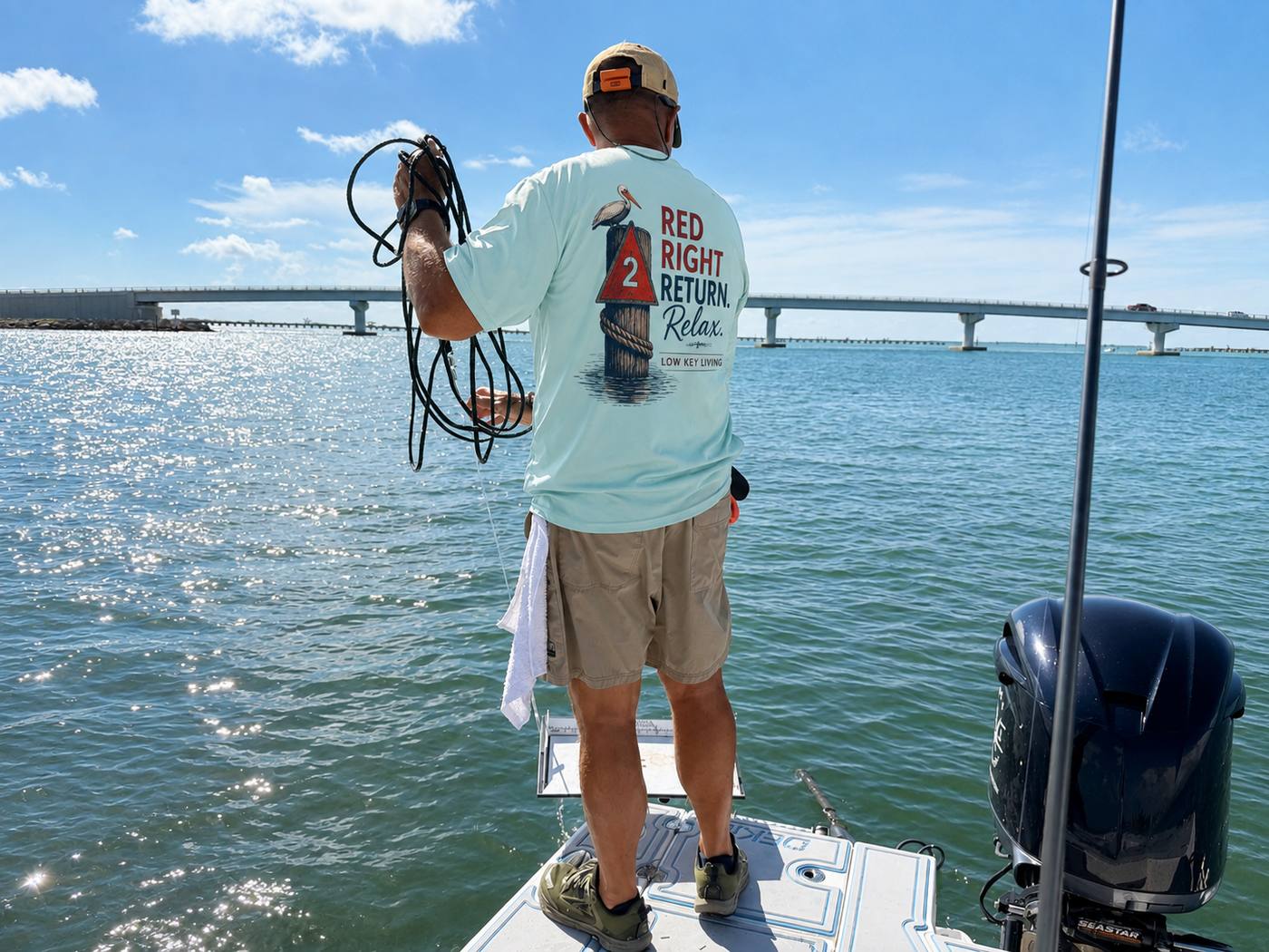 Low Key Living Red Right Return shirt worn aboard a boat on Florida waters
