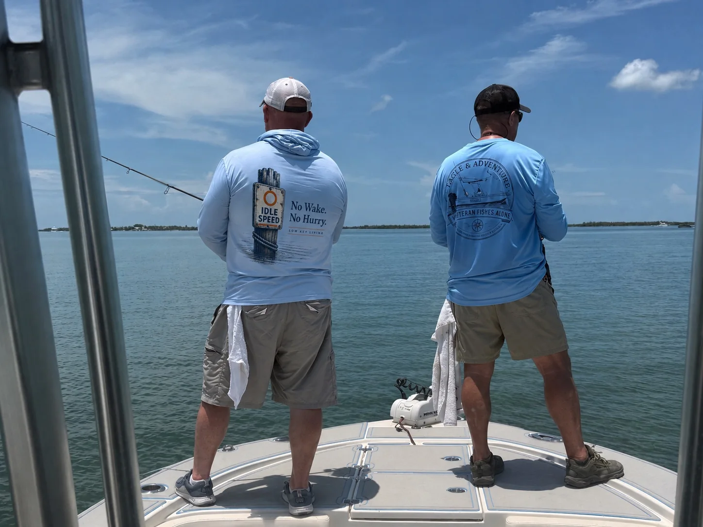 Two anglers sharing time on the water aboard an Eagle 6 Adventures boat